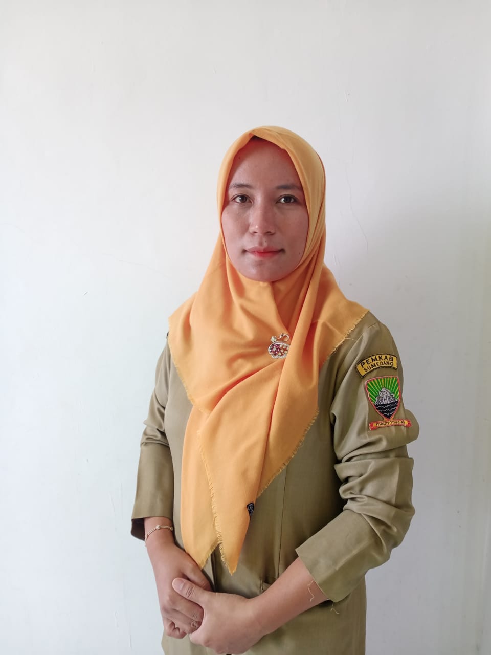 ELLY HERLINA RAHMAN, SKM